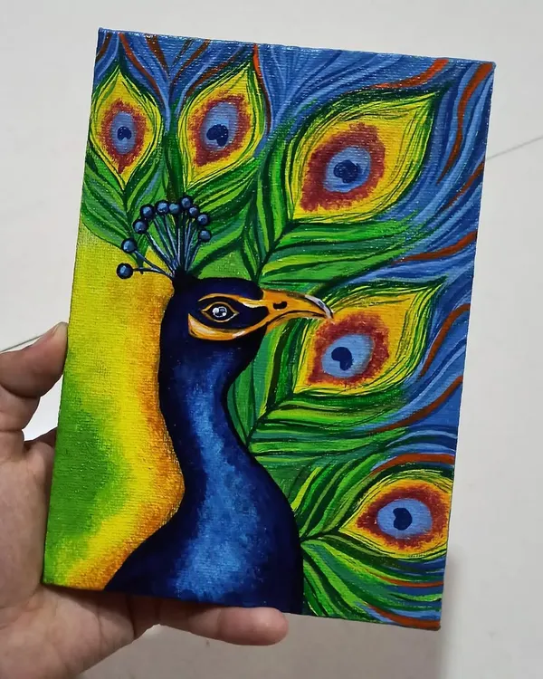 This acrylic painting of a peacock on a mini canvas captures the bird's magnificent colors. I used vibrant blues, greens, and yellows to make the feathers come alive.
