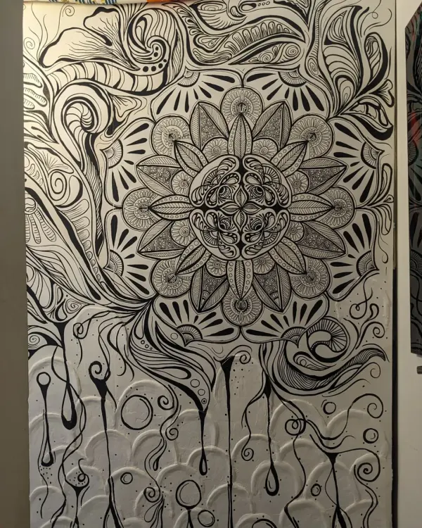 Here is the complete view of a mandala mural I created, combining a textured white base with intricate black doodle work. This piece was designed to transform a simple wall into a focal point of calm and detailed beauty, with every line and pattern painted by hand.