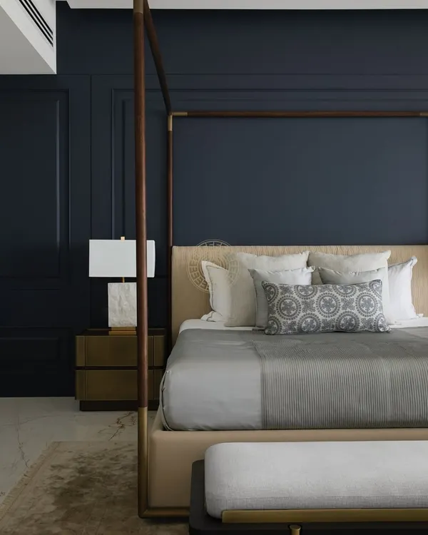 For this master bedroom in a South Bombay home, we created a moody and sophisticated sanctuary. A deep blue paneled wall serves as a dramatic backdrop for the four-poster bed, creating a perfect balance of drama and comfort.
