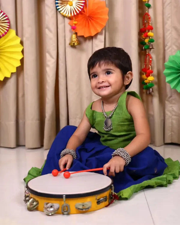 This little one’s smile says it all. My Nila Ghagra Choli, made from soft, breathable cotton, is designed for endless twirls and happy moments. It’s the perfect blend of vibrant color and comfort for any celebration.