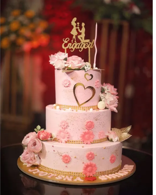 This three-tiered pink floral cake was the centerpiece for a beautiful engagement party. I love creating grand, romantic designs that mark the beginning of a couple's forever.