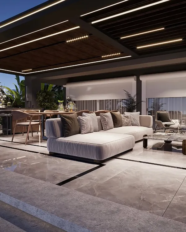 This luxurious backyard retreat in Delhi showcases a seamless integration of indoor and outdoor living. We designed a covered lounge with a modern pergola, a full dining area, and elegant marble flooring, creating the perfect environment for evening entertainment and relaxation.