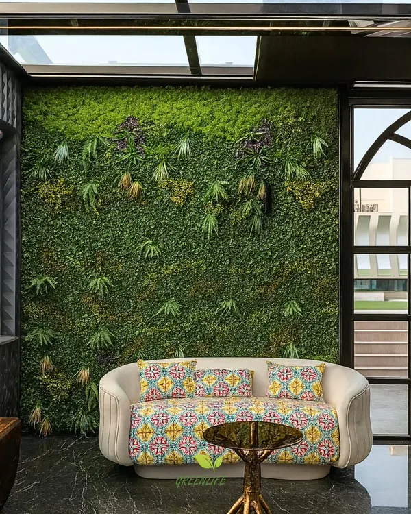 This artificial green wall serves as a stunning, maintenance-free backdrop. It adds texture, color, and a sense of nature to the room, perfectly complementing the modern furniture.
