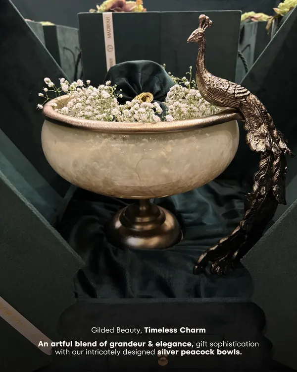 This is the essence of our craft. The magnificent Peacock Bowl, presented in a bespoke velvet-lined box, is more than a gift; it is a statement of grace and grandeur. I designed this piece to be a cherished centerpiece, a symbol of prosperity that makes a lasting impression at any celebration.