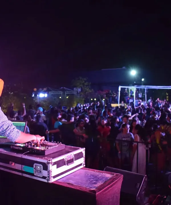 This is my view from the decks, a packed outdoor event with everyone lost in the music. I love commanding the energy of a large crowd, making sure every single person feels the beat. This is the vibe I bring to large-scale private parties and corporate events.