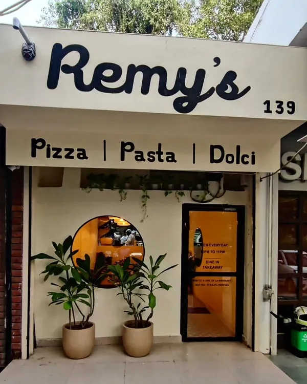 The storefront of Remy's, our Italian restaurant and cafe in Delhi. We designed it to be a warm and inviting space for everyone. We are open every day from 12 PM to 10 PM for dine-in and takeaway.