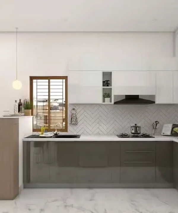 This bright and modern kitchen includes a neat breakfast bar for two. The two-tone cabinet design and herringbone backsplash create a stylish backdrop for this cozy and functional dining spot.