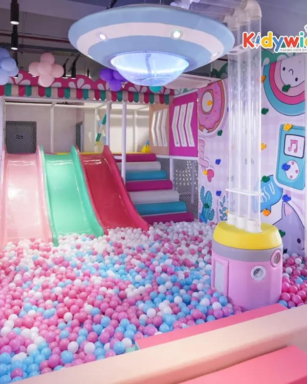 Welcome to The Fun Burrow! This magical playland features a huge ball pit with slides, offering endless fun for little ones in a pastel-themed, dreamy environment.