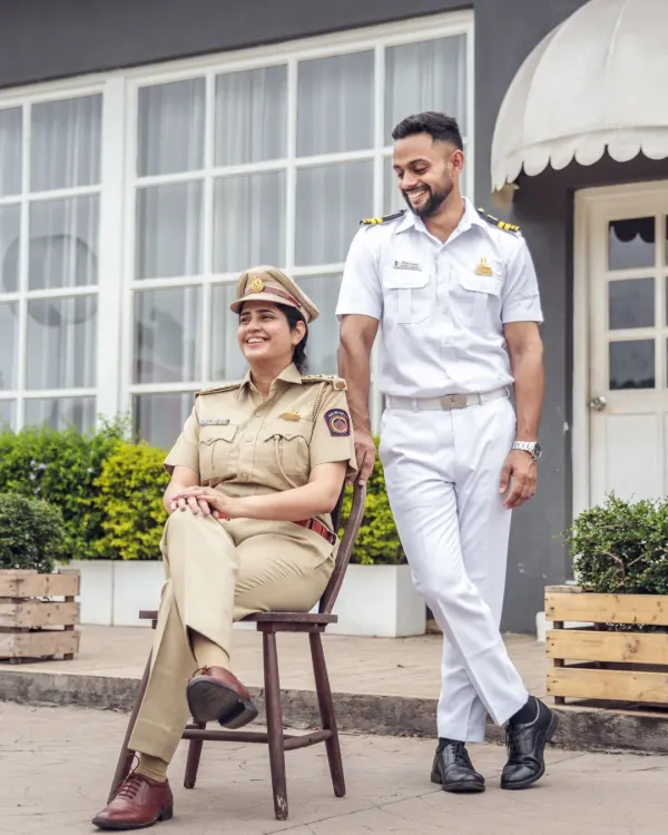 Celebrating a union of two heroes. This unique concept features the bride in her police uniform and the groom in his naval attire, creating a powerful and deeply personal pre-wedding portrait.