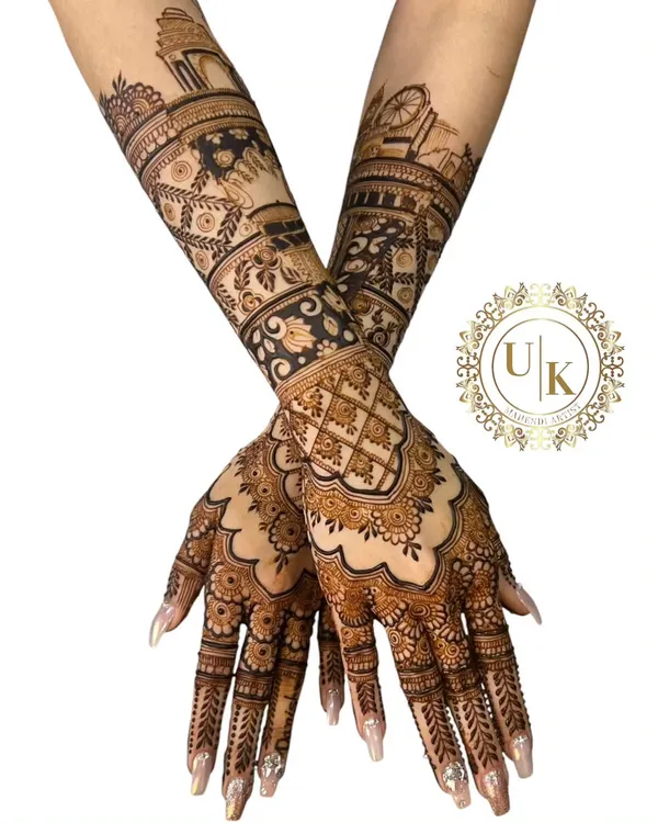 This is a full bridal-style mehandi with incredible detail. I've included architectural elements like India Gate and the London Eye, showing how we can blend different themes into a traditional Rajasthani design.