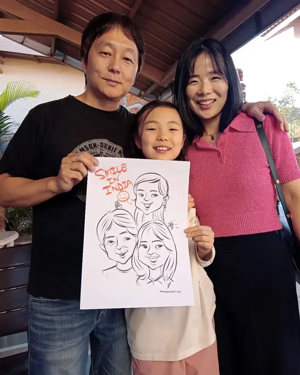 It was a pleasure to draw this happy Korean family. My art transcends language, bringing smiles to people from all over the world. "Smile in India" indeed!