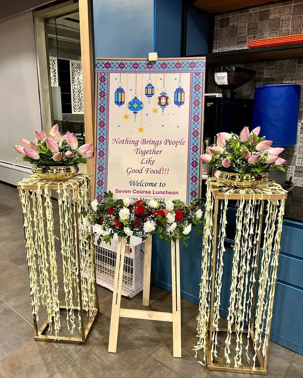The welcome setup for a seven-course luncheon I hosted for Canara HSBC's special international guests. The elegant floral decor and personalized signage set the tone for a sophisticated dining experience.