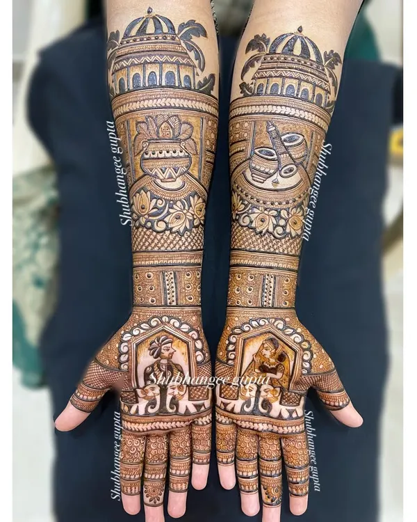 A full view of a classic bridal mehndi design. I included bride and groom portraits, elephants for good luck, and architectural domes on the forearms. Every part of this design is filled with detail.