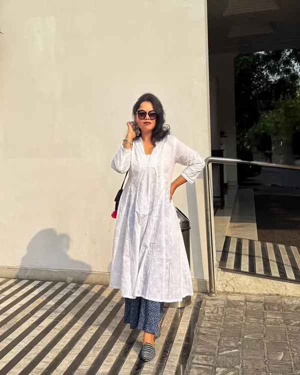 Grace and confidence in a classic white kurta layered over printed palazzo pants. I guide clients on styling ethnic and fusion wear that feels authentic and looks polished.