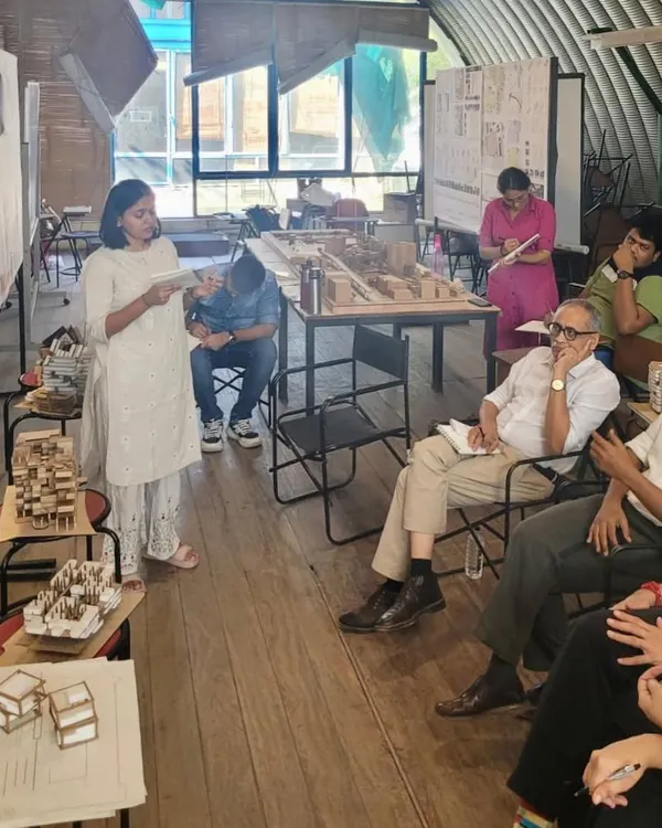 A student presents her work during a final design review at CEPT University. These reviews are intense, critical dialogues that push students to clarify their thinking and strengthen their architectural proposals.