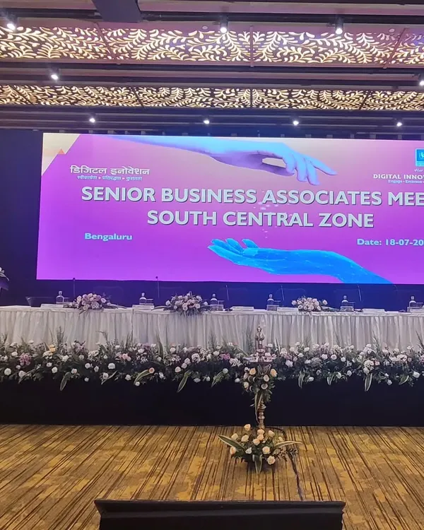 A full view of our stage setup for the LIC Senior Business Associates Meet at Taj Yeshwantpur, Bengaluru. We handled the large LED backdrop, floral arrangements, and lighting to create a professional and impressive atmosphere for the conference.