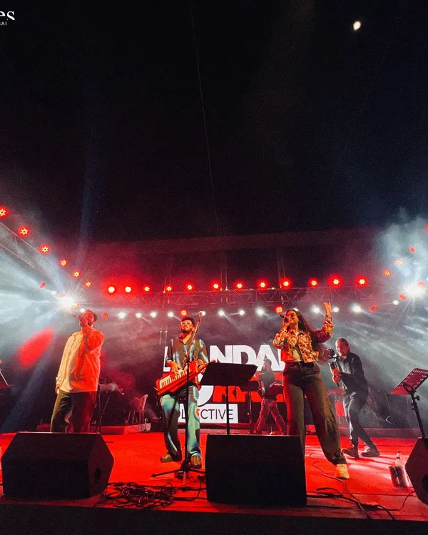 A wide shot of the entire band on a massive stage, surrounded by an impressive light show. This is the scale of production and energy we bring to large open-air concerts and festivals.