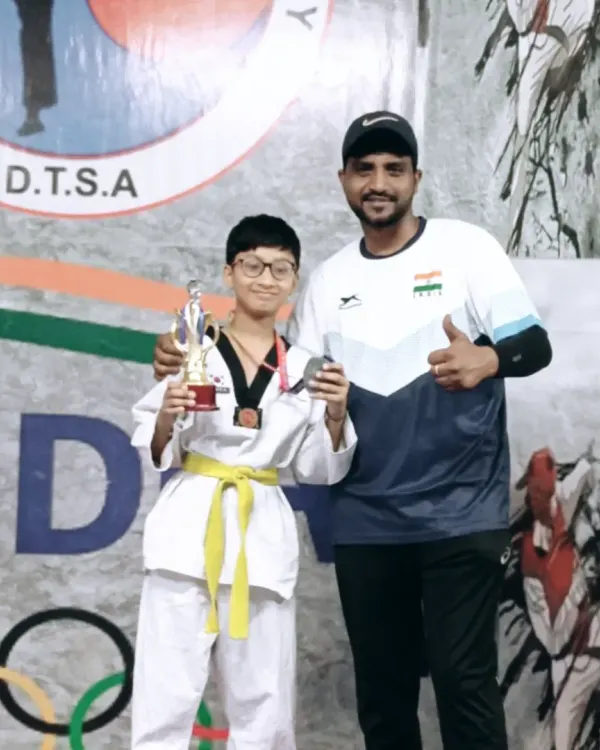 A proud moment with one of my champions from the DTSA team. His trophy and medal are a testament to his hard work at the Siri Fort Sports Complex competition.