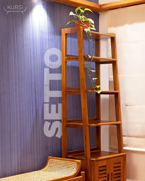 The Setto bookshelf, seen here against a textured wall, is a classic and chic storage solution. Its open shelves are perfect for books and decor, while the lower cabinet keeps things tidy.