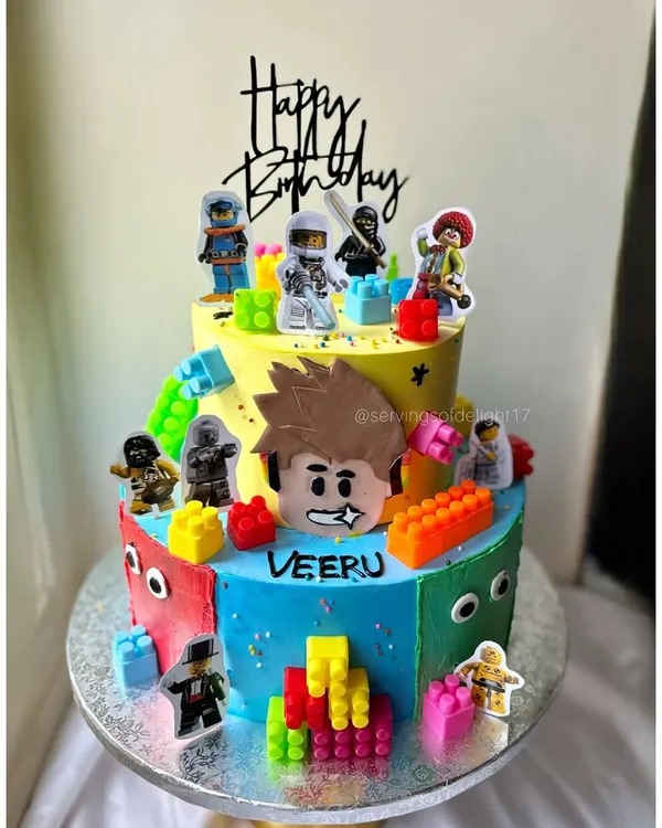 A block party on a cake! This vibrant two-tier Lego-themed cake was so much fun to build, with edible blocks and character toppers for the birthday boy.
