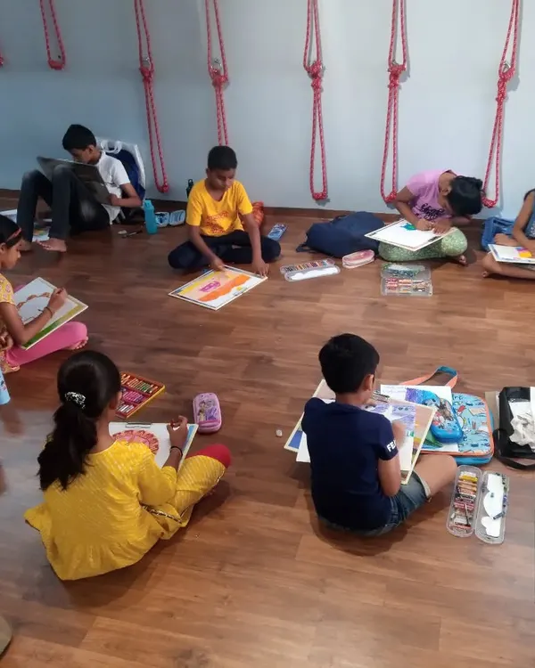 Our students are hard at work during a drawing session in the studio. We ensure a comfortable and inspiring space where children can sit and focus on bringing their ideas to life on paper.
