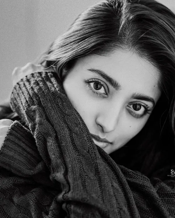 A simple, stunning black and white portrait. The close crop and direct gaze create an intimate and powerful image that focuses entirely on expression.