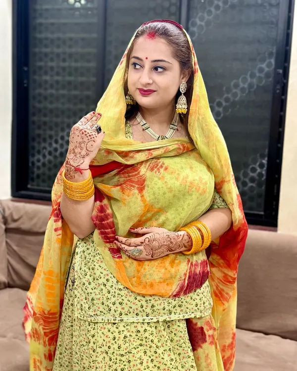 A beautiful customer looking radiant in her traditional attire, complete with our jhumkas and hand ring.