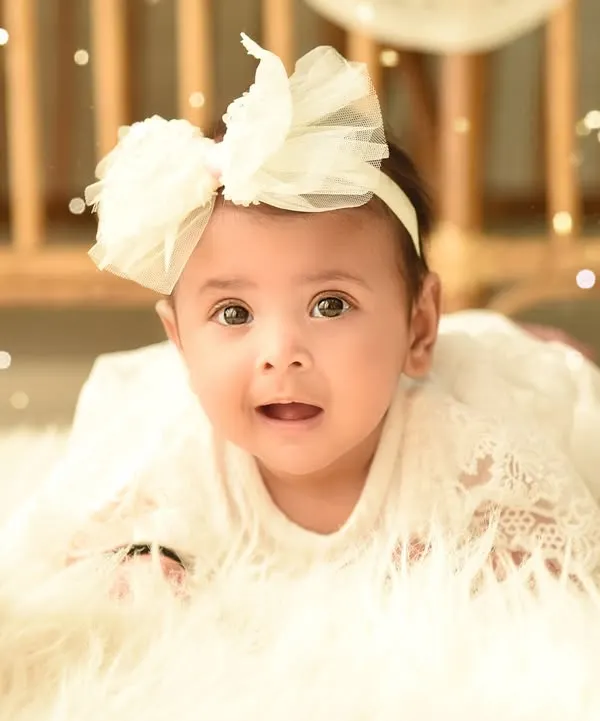 A simple and beautiful close-up of a sweet baby girl. Using a soft, fluffy rug and gentle lighting, I keep the focus entirely on her innocent expression.