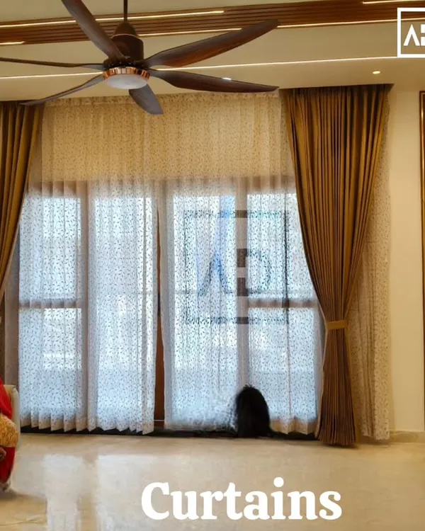 This is the kind of transformation I love to see. Here, I installed a double rod system with delicate sheer curtains for daytime privacy and heavy, elegant blackout curtains for complete light control in a beautiful living room.