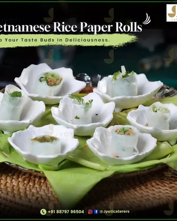 Delicate Vietnamese rice paper rolls, filled with fresh ingredients and served in elegant, flower-shaped ceramic bowls for a light and healthy appetizer.