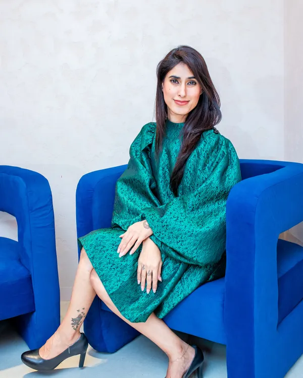 Here I am in a structured emerald green dress, demonstrating how a bold color and a strong silhouette can create a powerful and elegant look. The black pumps keep it classic and grounded.