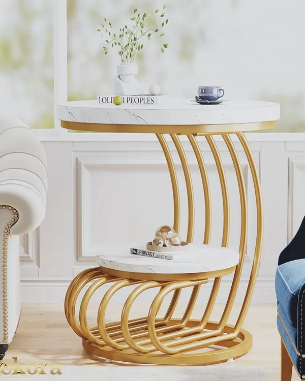 This two-tier accent table combines a sculptural gold-finish metal base with elegant white marble-finish tops. It is a perfect example of our functional and stylish living room furniture, offering ample surface space for decor, books, and beverages.