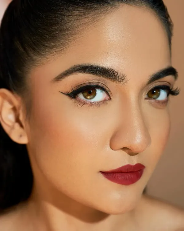 Look at that precision. My student Lovey created the perfect classic winged liner and red lip, a timeless combination that every artist needs to master.