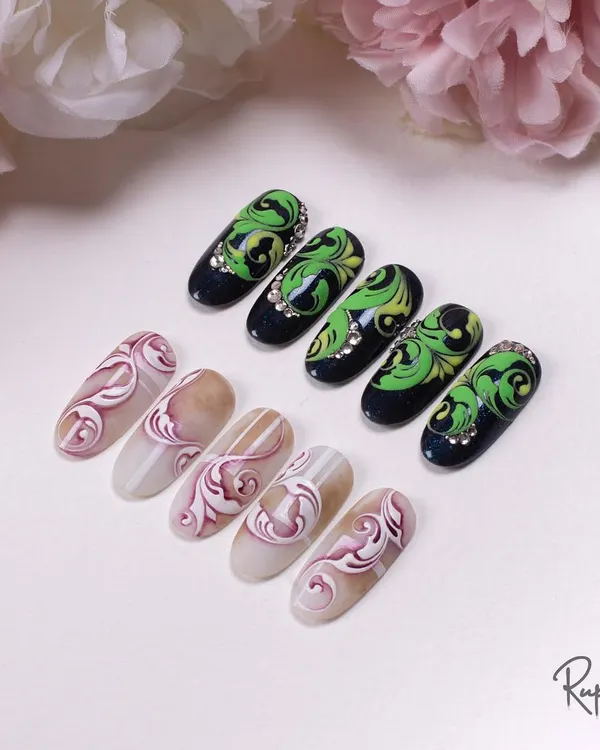 This image shows two different styles of complex swirls. On the left, a subtle tone-on-tone effect, and on the right, a high-contrast design with crystal accents.