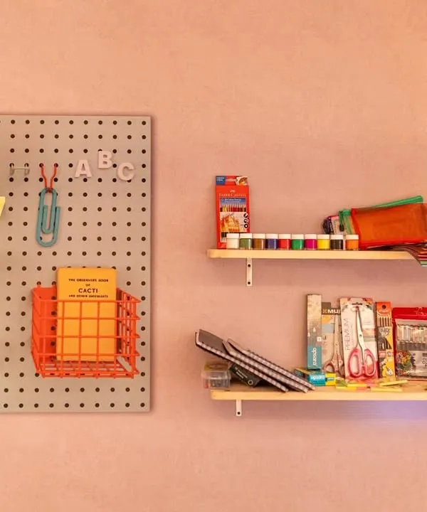 A close-up of the 'Stationery Shop' setup for a 25th anniversary. We sourced nostalgic items to make the experience authentic and fun, reminding guests of their school days.