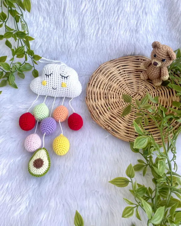 This sleepy cloud wall hanging is one of my cutest nursery decor items. It features colorful "raindrops" and a customer requested a mini avocado, which was a fun addition.