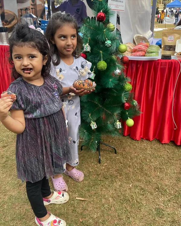 Two of my cutest little clients enjoying some chocolatey treats at a Christmas market. Their happy faces say it all.