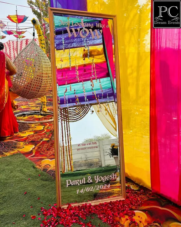 A fun and interactive detail for a Haldi ceremony. I created this personalized mirror with the couple's name and a trendy "So Looking Like a Wow" quote for guests to take selfies with.