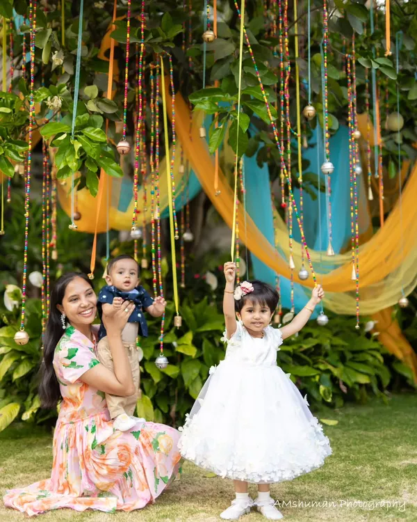 A beautiful family moment captured in our musical garden. The hanging beaded bells and colorful drapes created a perfect sensory playground for the little ones to explore and enjoy.
