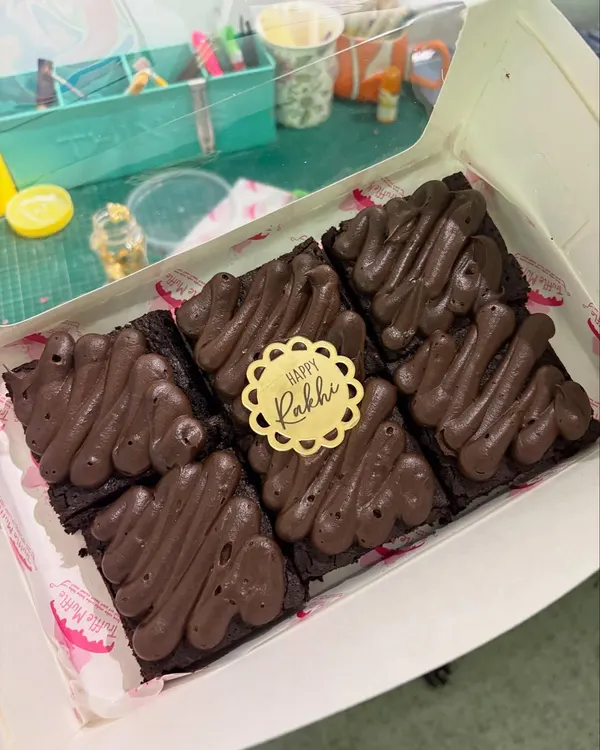 A box of my fudgy chocolate brownies, topped with extra chocolate frosting. This was part of my Rakhi specials, finished with a 'Happy Rakhi' tag.