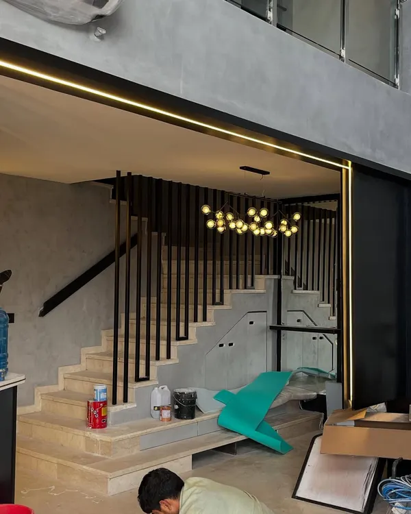 Proof that 'under construction' can still have style. With the dramatic staircase, modern railings, and integrated lighting already in place, this space looks cool even before it's finished.