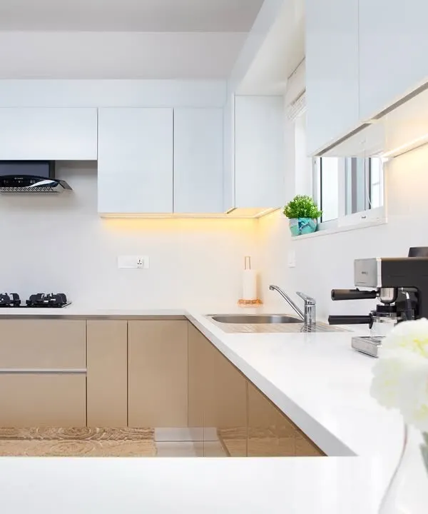 There’s something magical about how warm tones and crisp whites come together in a kitchen. The soft glow from the under-cabinet lights is perfect for early mornings. This is everyday luxury.