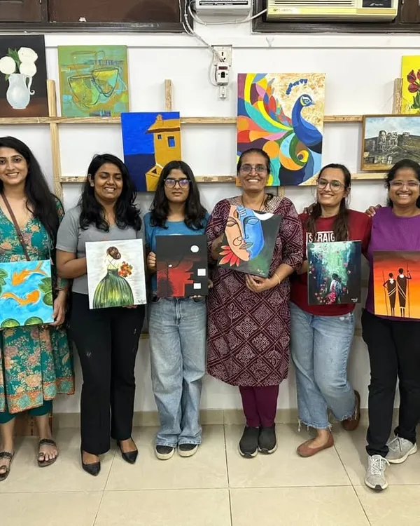 A group of doctors from AIIMS proudly displaying the diverse artworks they created during our acrylic painting workshop. Art is a powerful tool for relaxation and team bonding.
