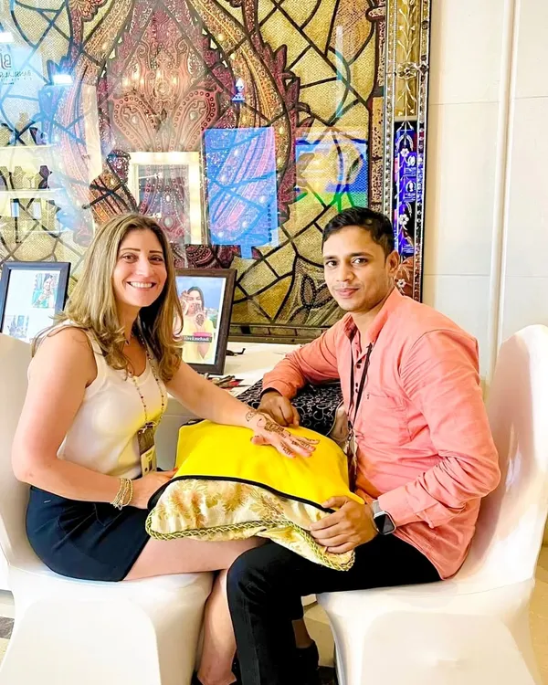 This is me, Vivek, with a happy client. For me, mehndi is not just a job, it is an emotion. Every design I create is a story, and I am grateful to be the one to draw it for you.