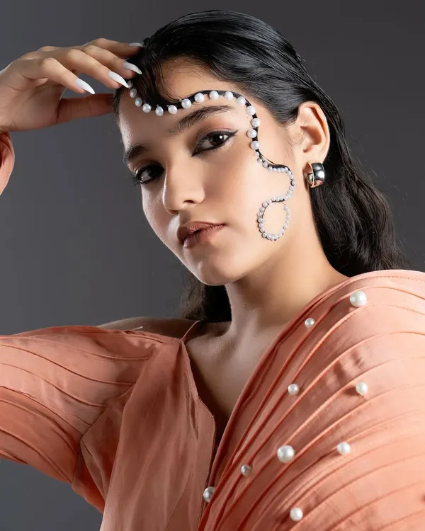 An editorial look created by our student for the JD Fashion Institute. This showcases their creativity with graphic elements and pearl embellishments for a high-fashion concept.