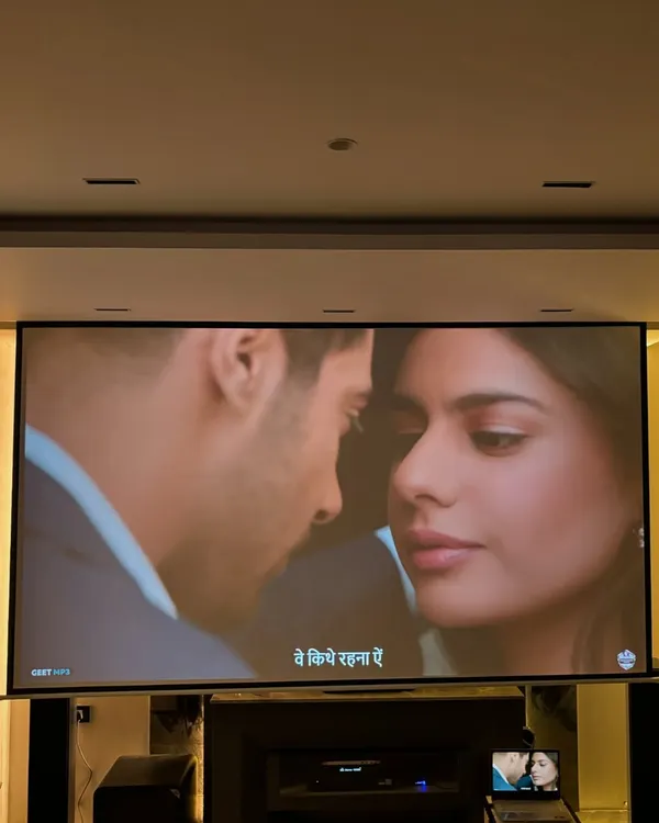 A close up of the 133 inch motorized screen in action. The picture quality from the ViewSonic 4K projector is so sharp and clear, it feels like you have a commercial cinema in your living room.