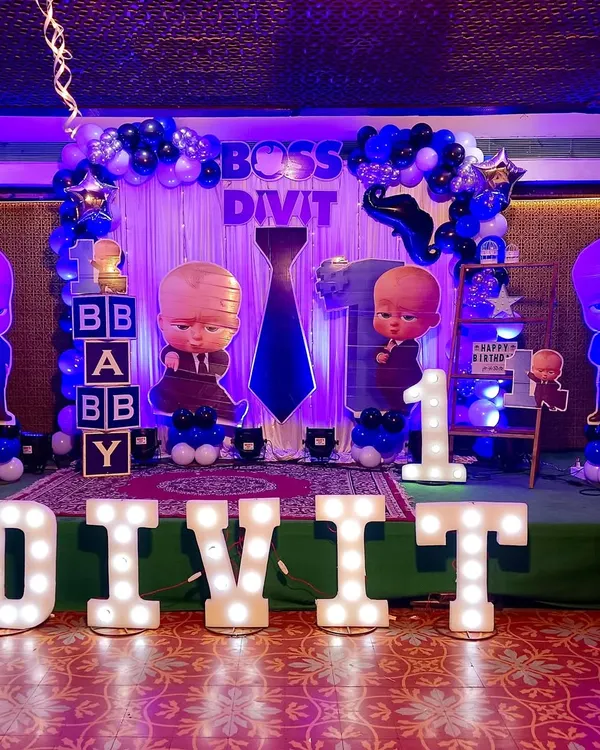 This complete Boss Baby themed birthday decoration includes a balloon backdrop, large character cutouts, and light-up marquee letters spelling the birthday boy's name. It’s a full setup to make your child feel like the boss.