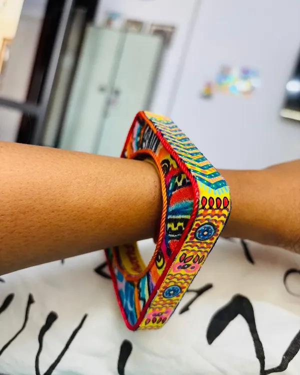 Here’s how the square Banjara Bangle looks on the wrist. It’s designed to be a bold statement piece that showcases intricate, hand-painted details from every angle.