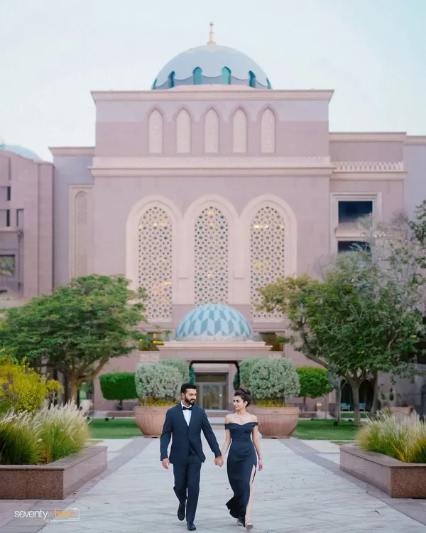 Walking hand-in-hand through the magnificent grounds of the Emirates Palace in Abu Dhabi. This is elegance and romance on a grand scale for a truly palatial pre-wedding shoot.