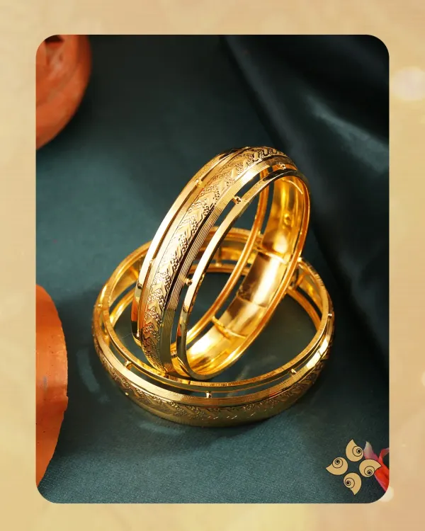 Wrapped in tradition, shining with love. These broad gold kadas feature a detailed etched pattern, making them a timeless and substantial piece for bridal or festive wear.